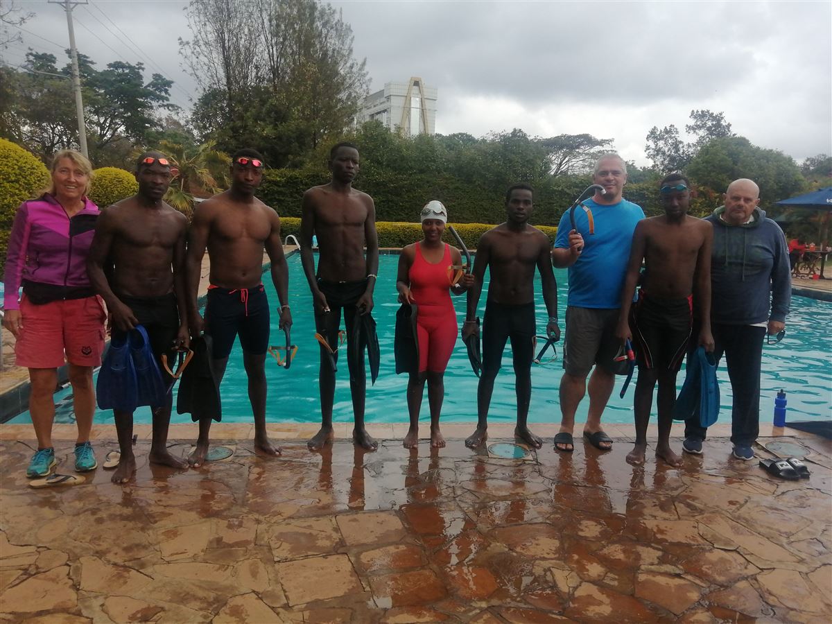 Participants and coaches of Finswimming Xperience Kenya by the pool in Nairobi